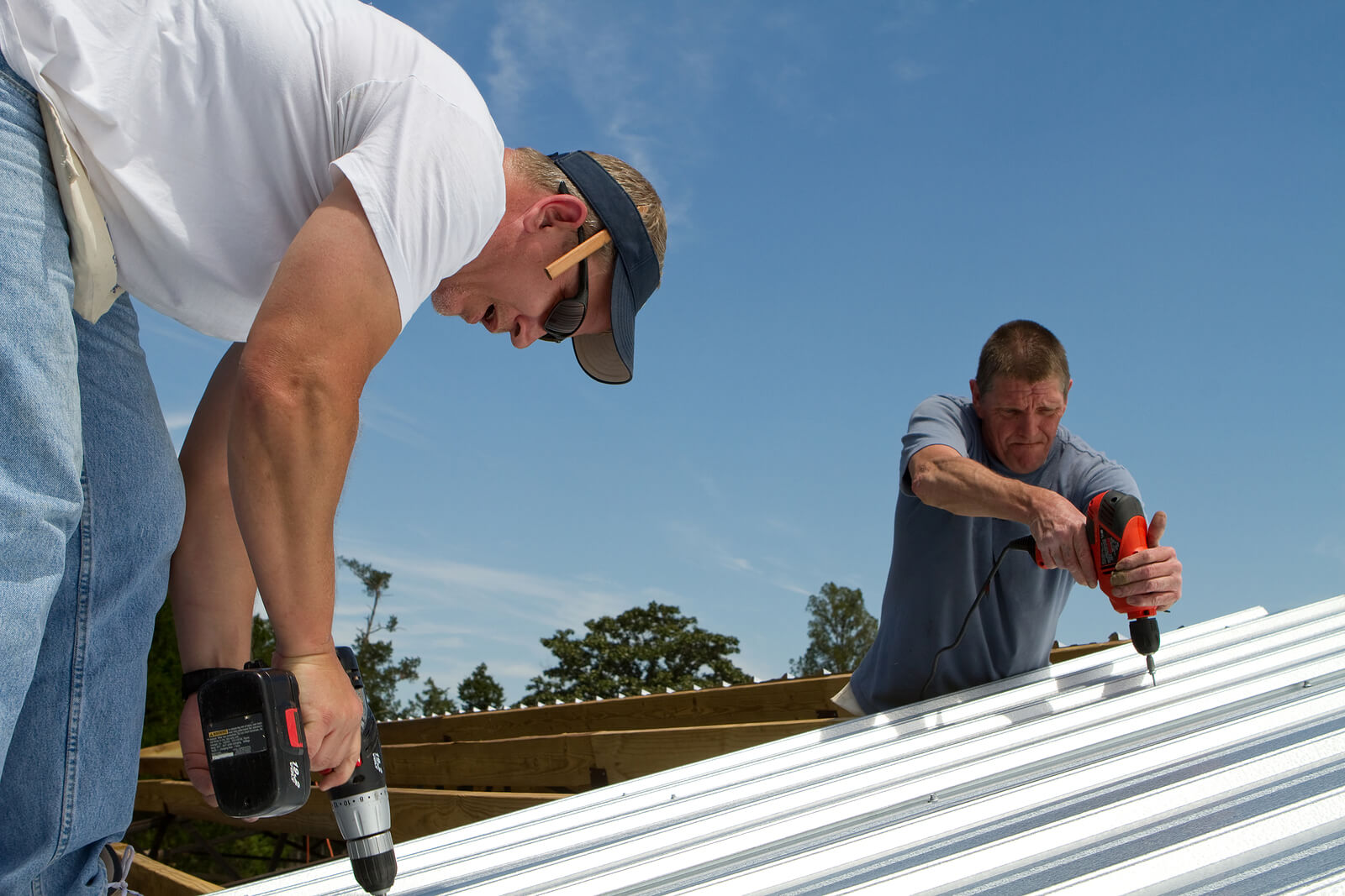 contractors fixing roof for skylight installation