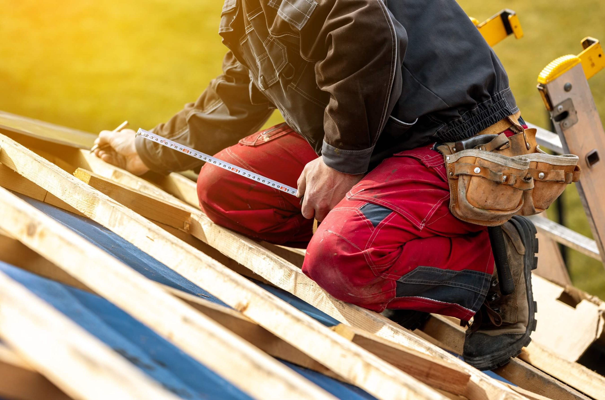 roof contractor maintaining solar powered skylight
