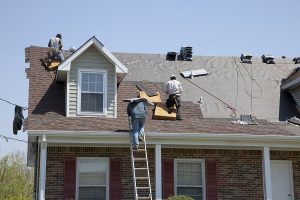 roofers working on vented skylight