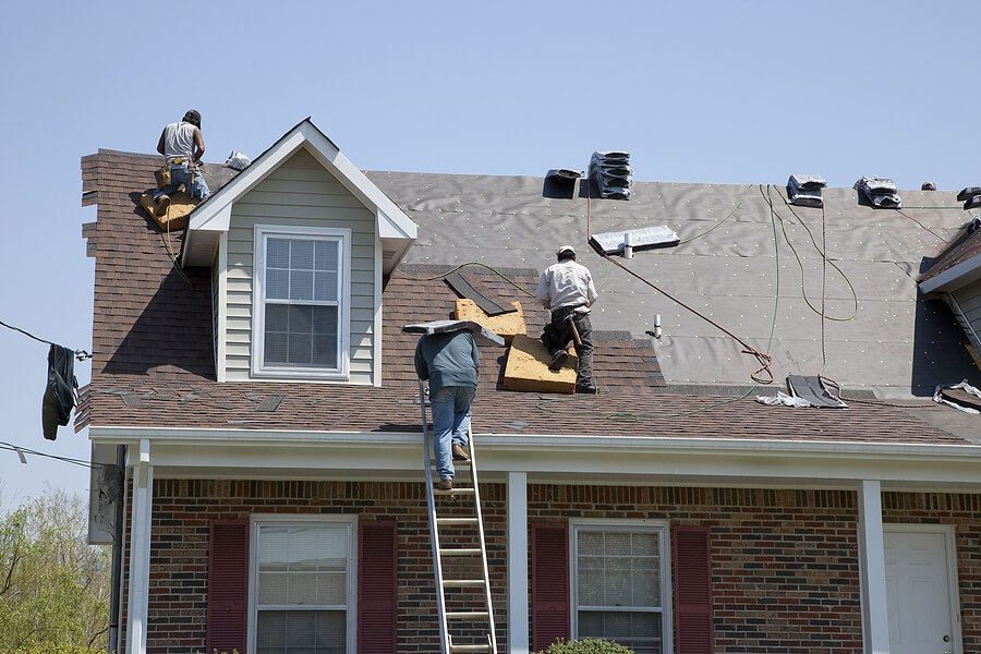 roofers working on vented skylight